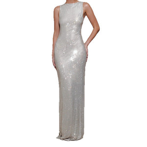 Floor-length rhinestone evening gown sparkling under light in a bodycon fit