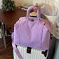 Travel duffel bag opened to show the separate dry and wet compartment inside