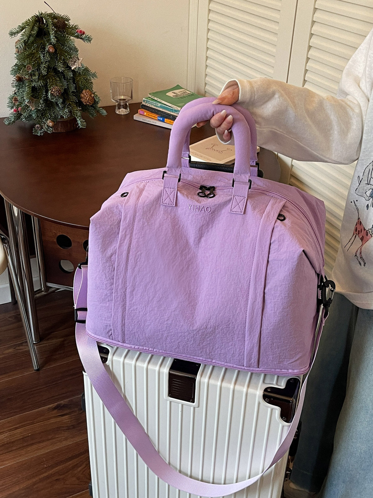 Travel duffel bag opened to show the separate dry and wet compartment inside