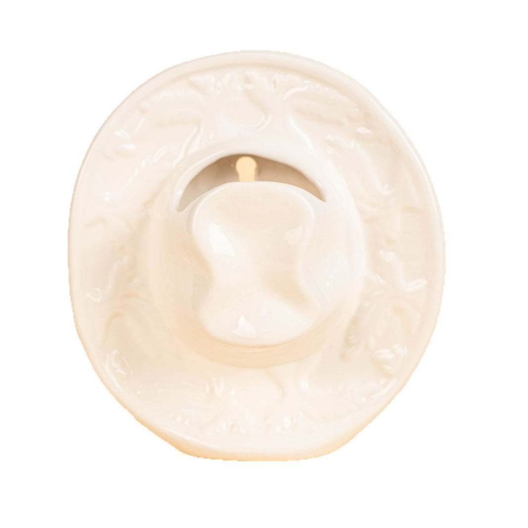 Empty white glazed cowboy hat vase seen from the front, crown opening visible