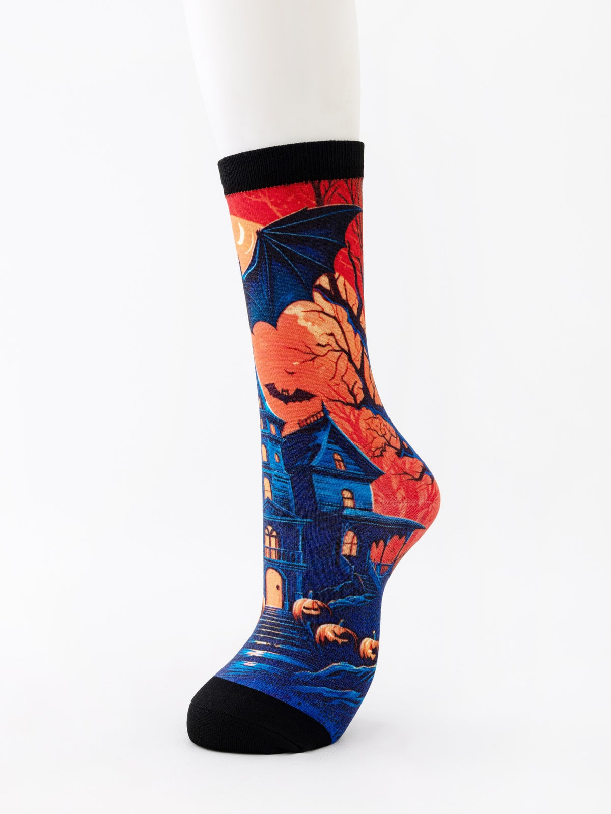 Mid-calf sock on a mannequin printed with a blue haunted house, bats and pumpkins