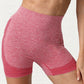 Front view of the red heather yoga shorts, wide high waistband and jacquard hem panel