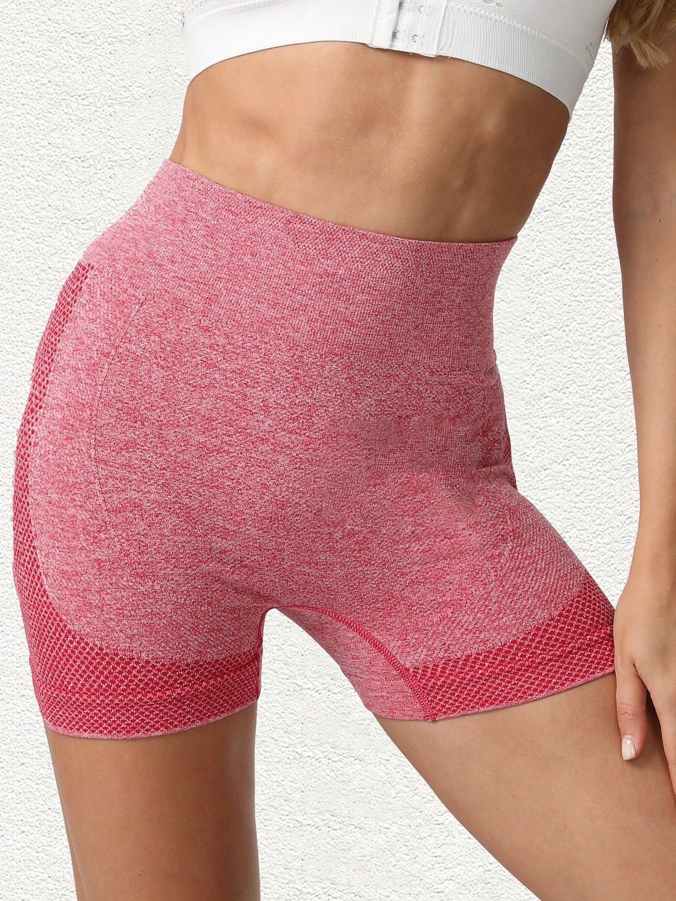 Front view of the red heather yoga shorts, wide high waistband and jacquard hem panel