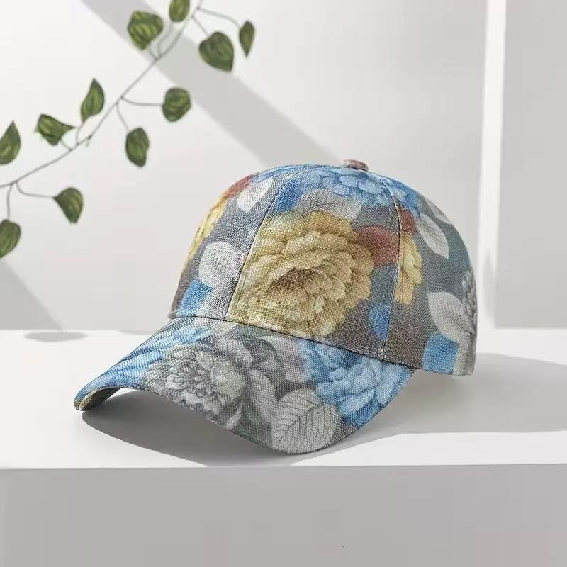 Printed flower baseball cap with a rounded crown and adjustable rear strap