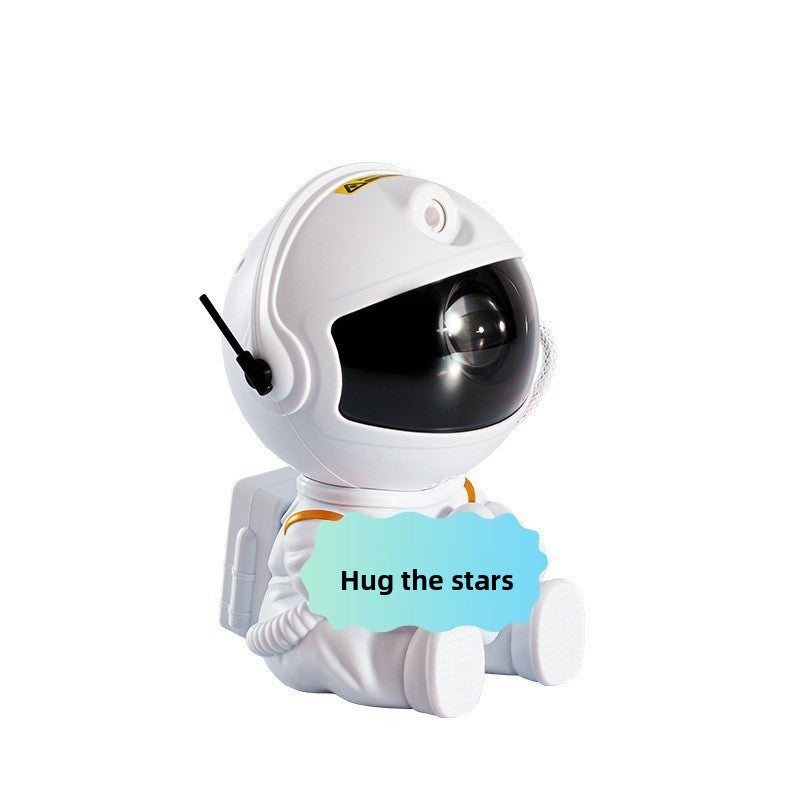 Astronaut night light projector with a tilting head to aim the projection lens