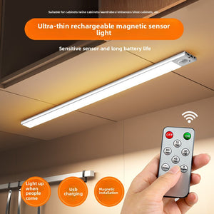 Ultra thin rechargeable motion sensor LED cabinet light shown mounted and lit under a cabinet