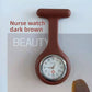 Cyan silicone nurse fob watch with a quartz analog face behind a glass crystal