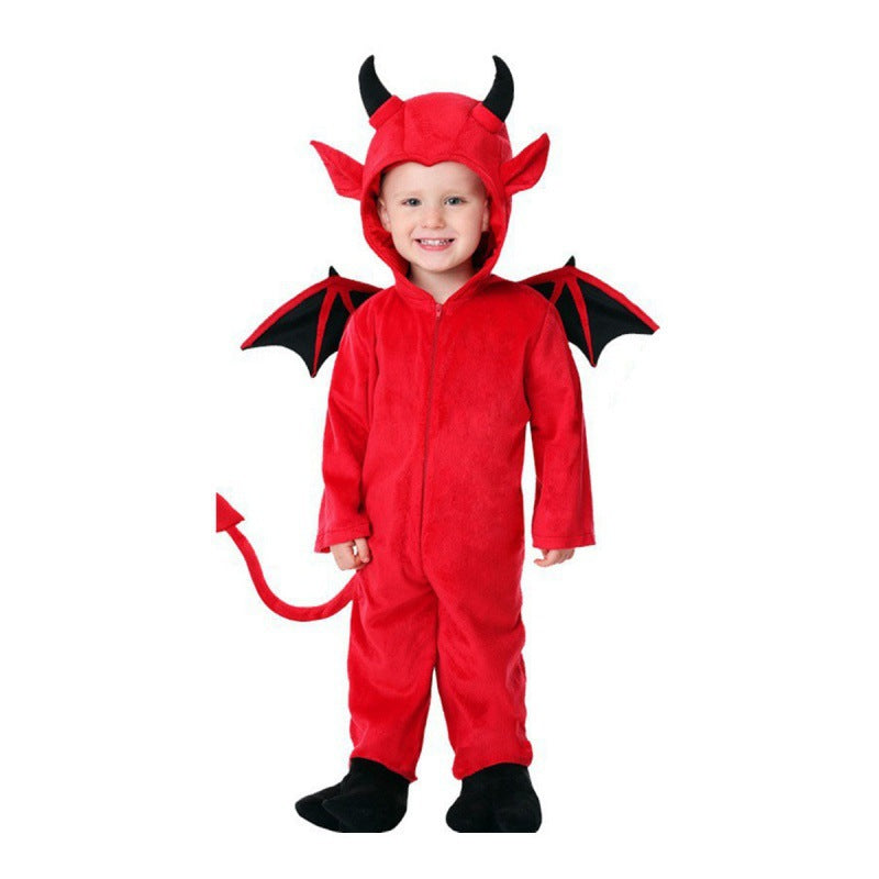 Child in the red plush devil jumpsuit with horns, black wings and tail, front view