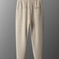 Back of the camel knit jogger trousers on a hanger with two back pockets and a ribbed waistband