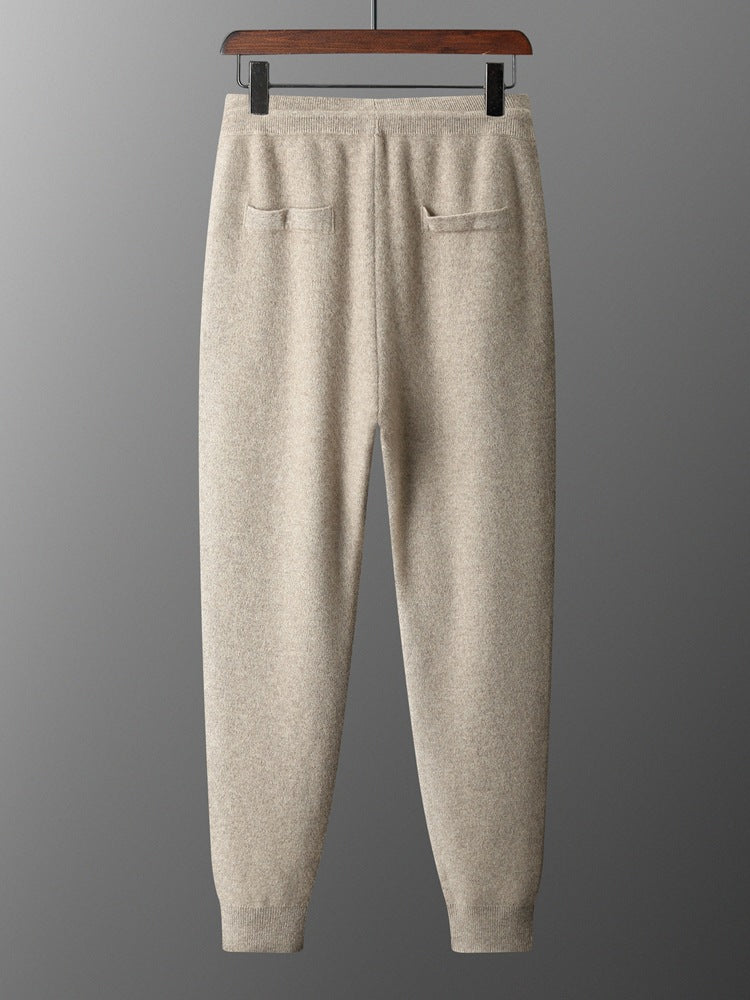 Back of the camel knit jogger trousers on a hanger with two back pockets and a ribbed waistband