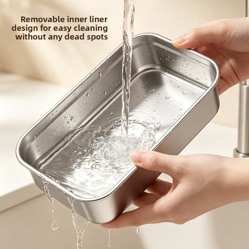 Rectangular 304 stainless steel liner being rinsed under running water in two hands
