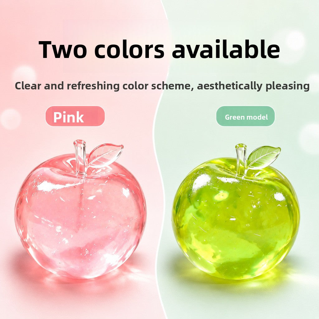 Pink and green translucent TPR apple squeeze toys shown side by side on a soft studio background