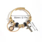Black cross charm cuff bangle on white with 55 mm inner span and 29.5 mm cross drop marked