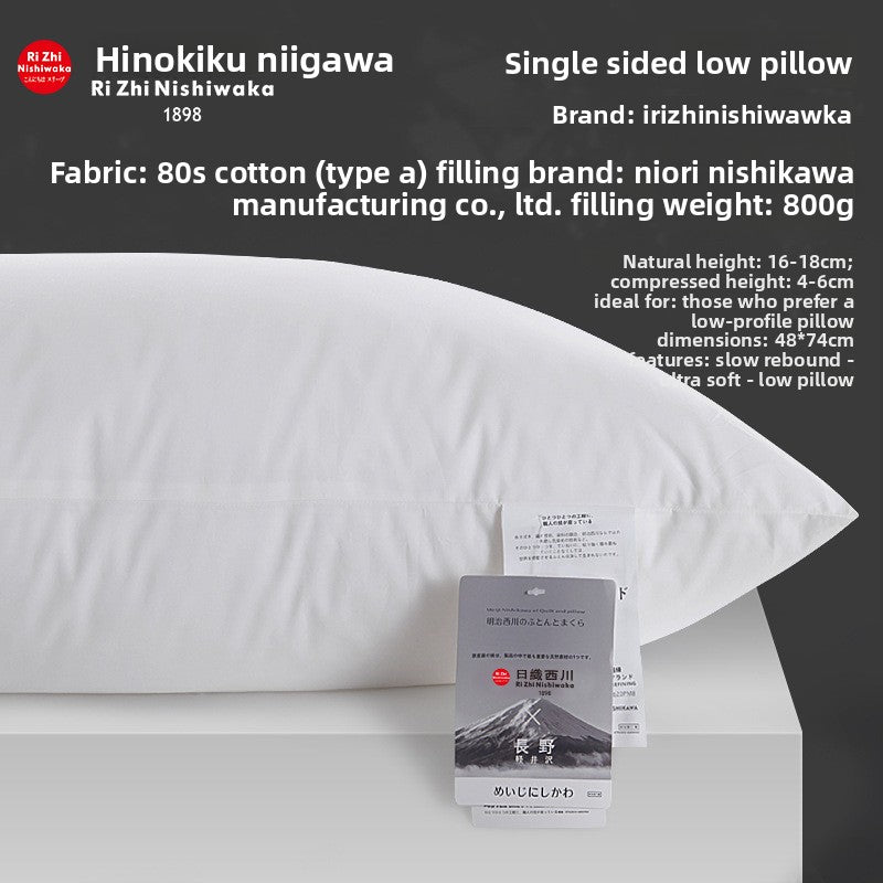 Single sided low bed pillow in profile on a pale surface, cotton ticking, 800 g of fill