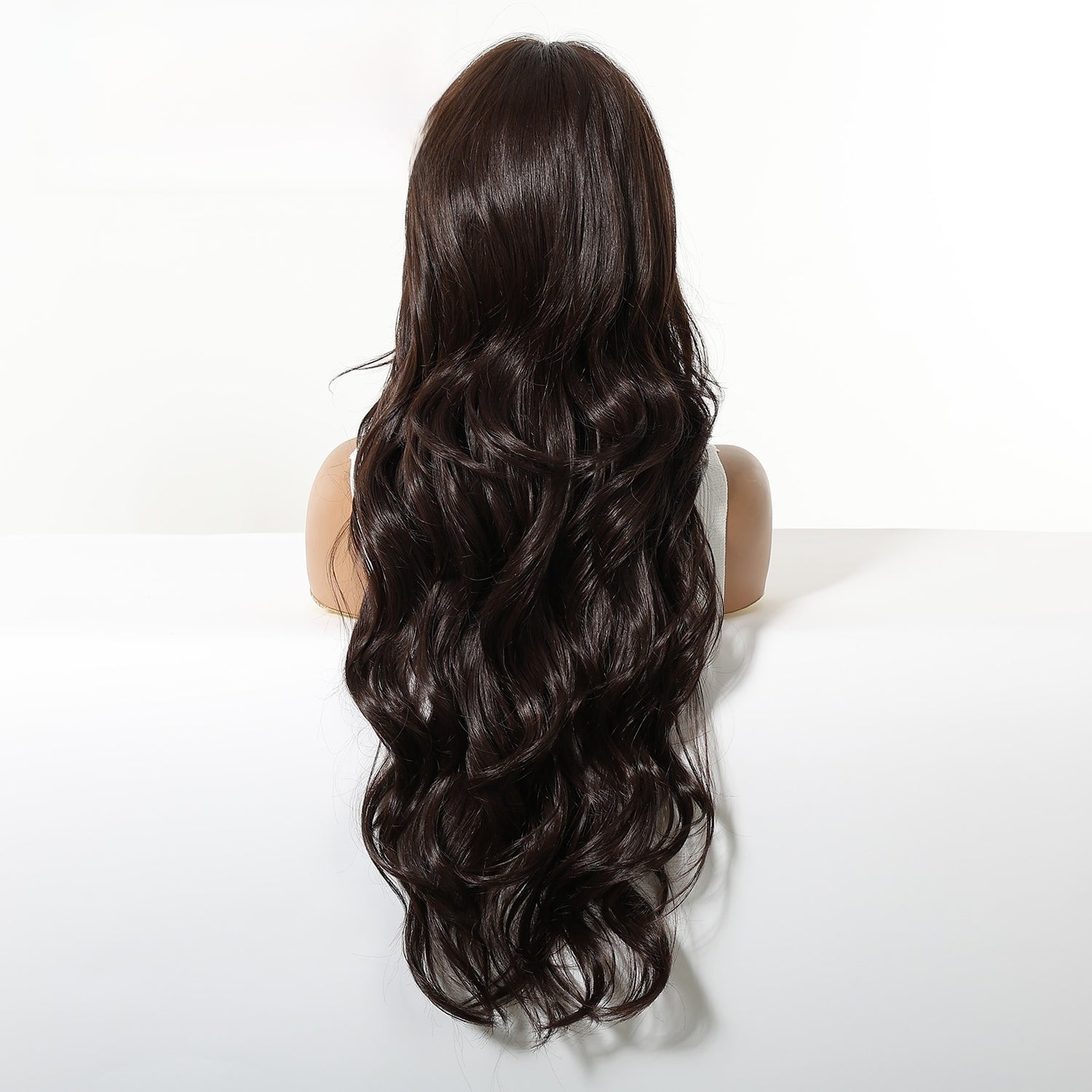Back view of the dark brown 28 inch wig, loose waves running the full length to below the ribs