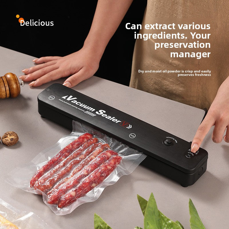Hands using the black vacuum sealer to seal a bag of cured meat on a kitchen counter