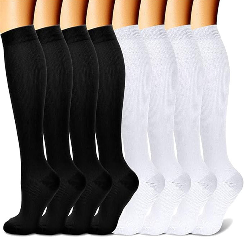 Knee-high compression socks displayed on legs across several pattern options