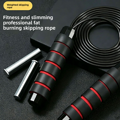 Black and red speed skipping rope coiled beside two chrome handle weight bars