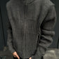 Torso view of the gray zip front knit cardigan showing the vertical rib panel on the chest and a ribbed sleeve