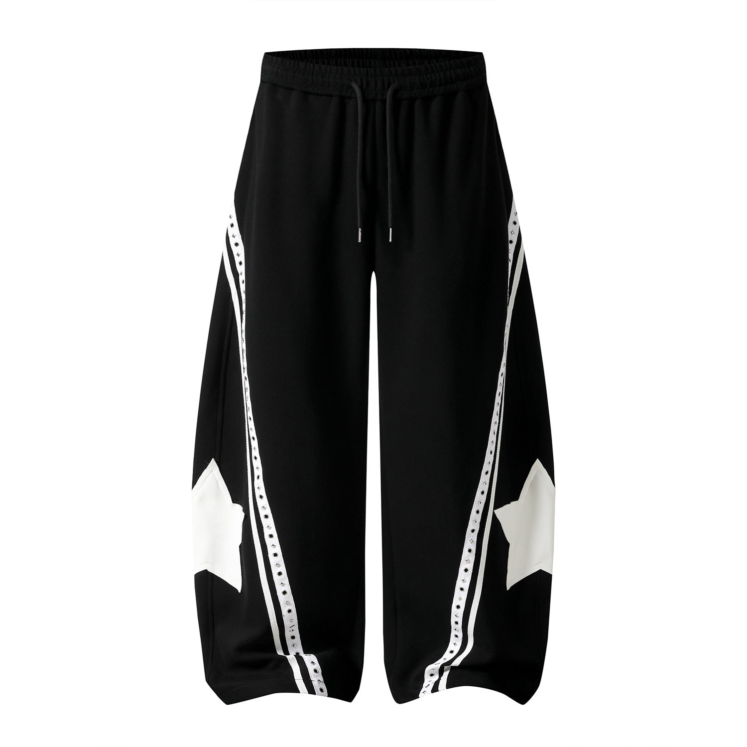 Star patch drawstring pants laid flat under soft studio lighting