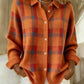 Orange option photo of an orange knit cardigan with a red plaid check, shirt collar, size XL