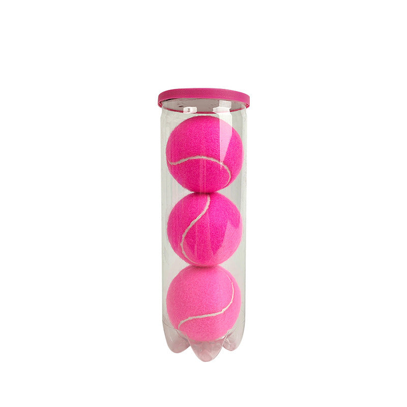 Clear tube holding three pink padel training balls with a pink lid on a plain white background