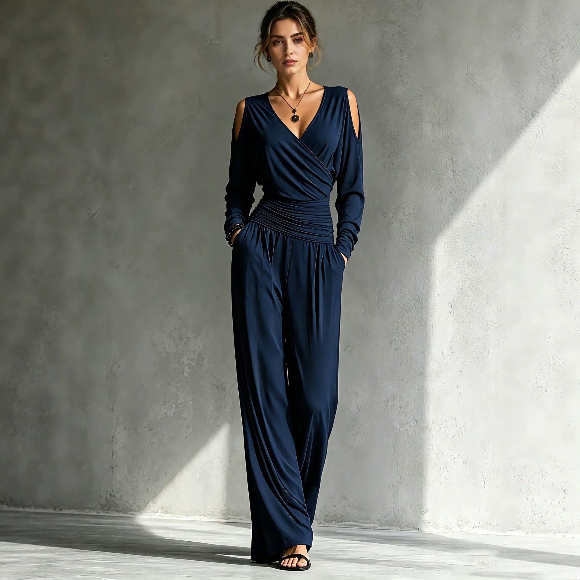 Wrap V-neck bodice of the jumpsuit with open cold-shoulder cutout at the shoulder