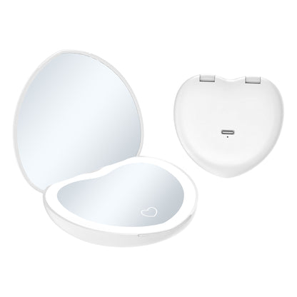 White heart shaped LED makeup mirror shown open with a lit magnified mirror and closed back