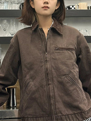 Model in brown workwear jacket showing full zip front and welt hand pockets