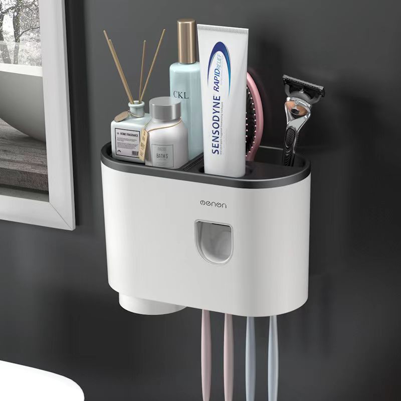 Open top tray storing skincare bottles, a comb and a razor at the sink