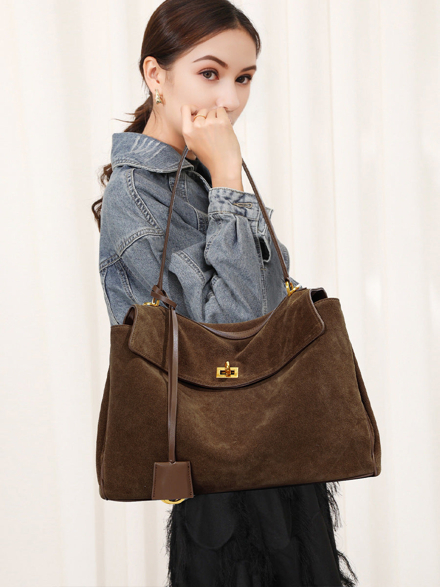 Frosted suede tote bag styled with a casual everyday outfit and crossbody strap