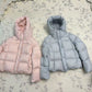 Hooded down puffer jacket shown flat, boxy short cut with a drawcord hood and front zip