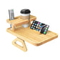 Close view of a bamboo sofa tray cup holder and remote slots on the raised shelf