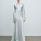 Folded light mint satin evening gown presented ready for gifting
