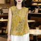 Close front of jacquard blouse showing round neck and side button placket