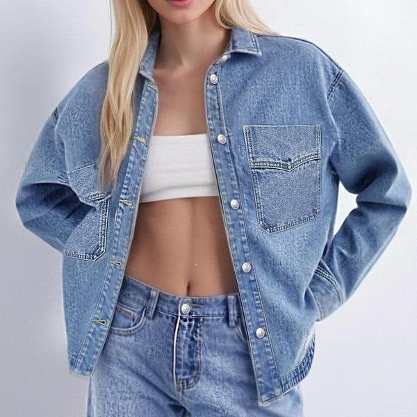 Woman wearing a washed blue denim shirt jacket with chest pocket, Blue size 2XL variant image