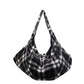 Black woolen check shoulder tote bag with adjustable strap and soft slouchy shape
