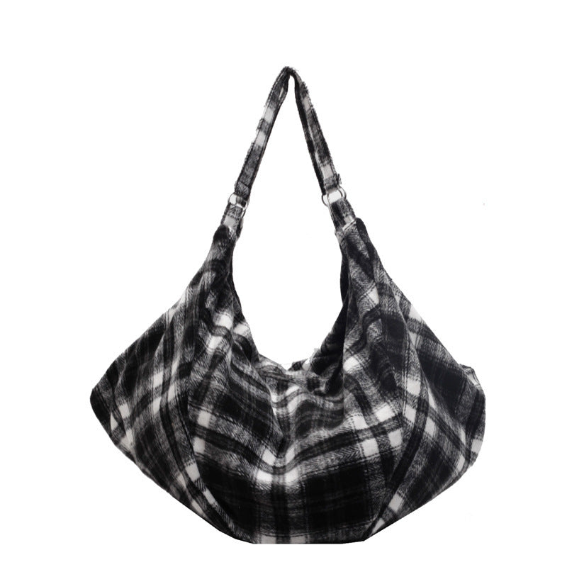 Black woolen check shoulder tote bag with adjustable strap and soft slouchy shape