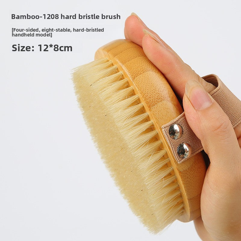 Hand holding the Moso bamboo 1208 hard bristle body brush with a bamboo base, with a caption of 12 by 8 cm