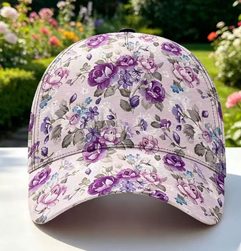 Floral pattern cap with a curved brim seen from the side on a pale surface