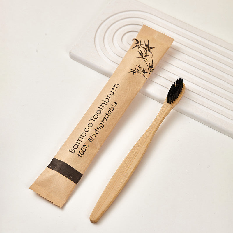 Bamboo toothbrush laid flat showing the smooth natural bamboo handle grip