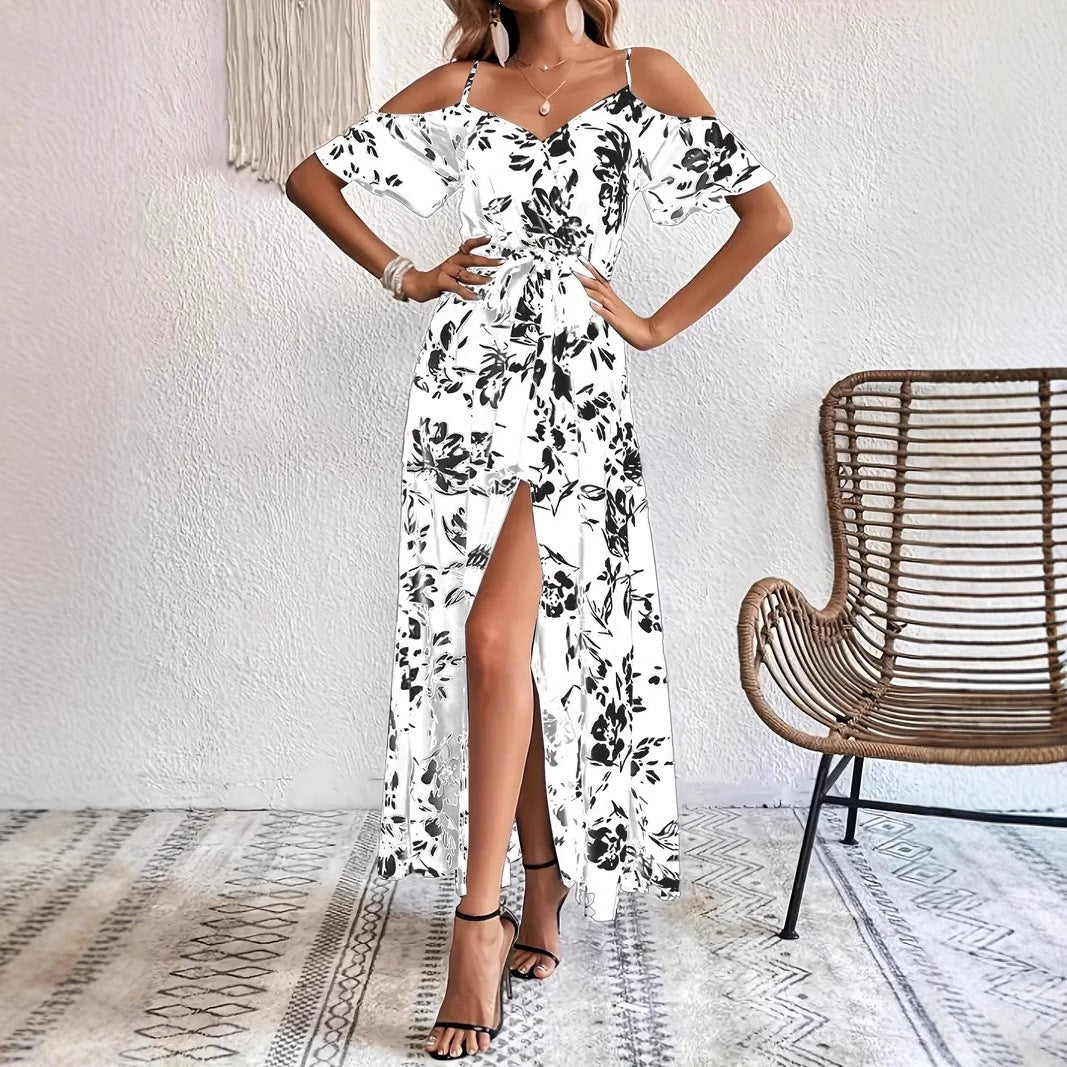 Floral maxi dress showing surplice V neckline and self tie sash at the waist