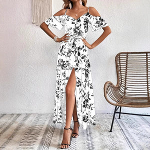 Floral maxi dress showing surplice V neckline and self tie sash at the waist