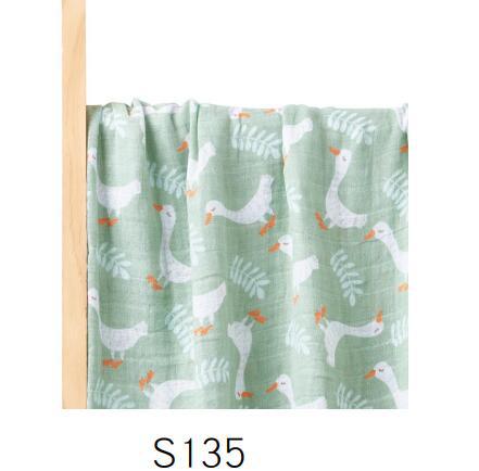 Folded cotton muslin swaddle blanket with a soft open weave and an even printed pattern