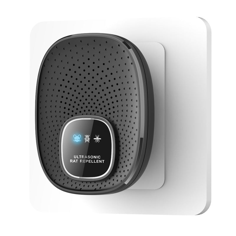 White ultrasonic plug in pest repeller shown on a wall
