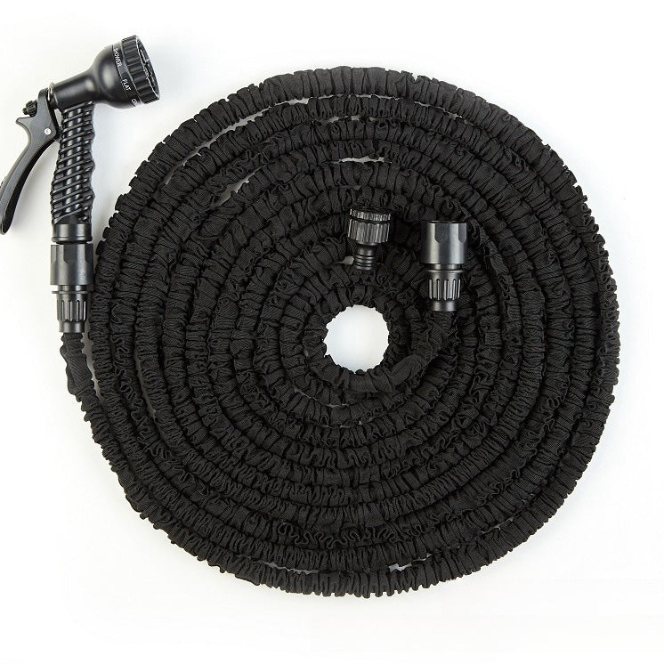 Blue expandable garden hose coiled with a seven pattern trigger spray gun