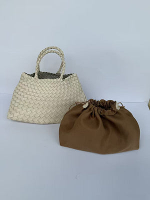 Milky white woven PU handbag with braided handles beside a brown drawstring pouch