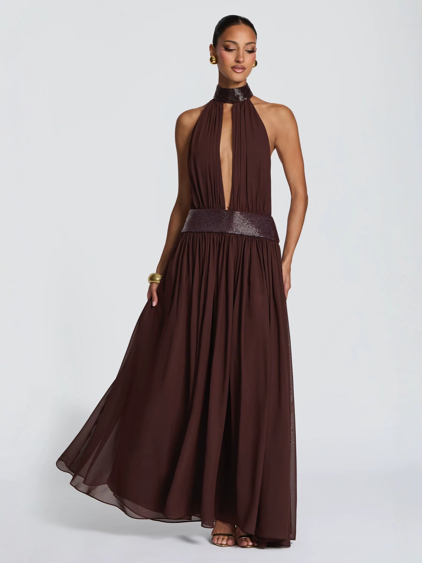 Backless halter chiffon maxi gown with sequin collar, full length view of the gathered chiffon skirt floating