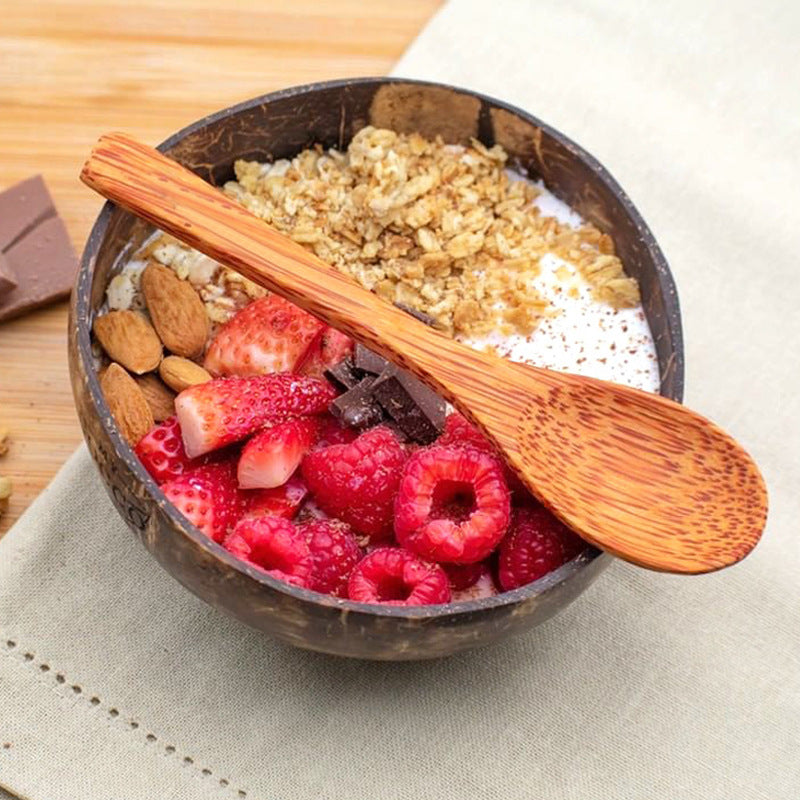Regular coconut shell bowl with granola, berries and a coconut wood spoon, Regular bowl and spoon set