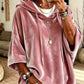 Loose womens hooded top with a drawstring hood shown on a model indoors